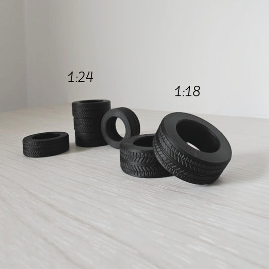 Grouped mini tires in different sizes for model car and garage dioramas