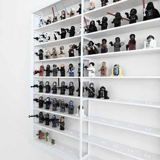 Angled side view of white LEGO display grid insert inside IKEA Sannahed frame filled with minifigures.