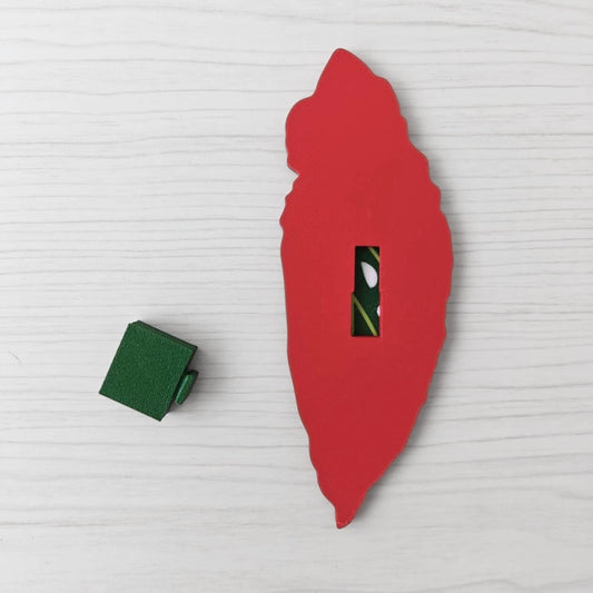 Back view of the Begonia leaf handle with the separate green key cover piece placed beside it.