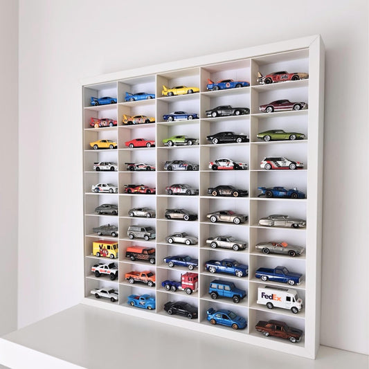 Angled view of diecast car display inside white Sannahed frame