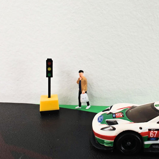 1/64 traffic light with miniature figure and race car in diorama setup