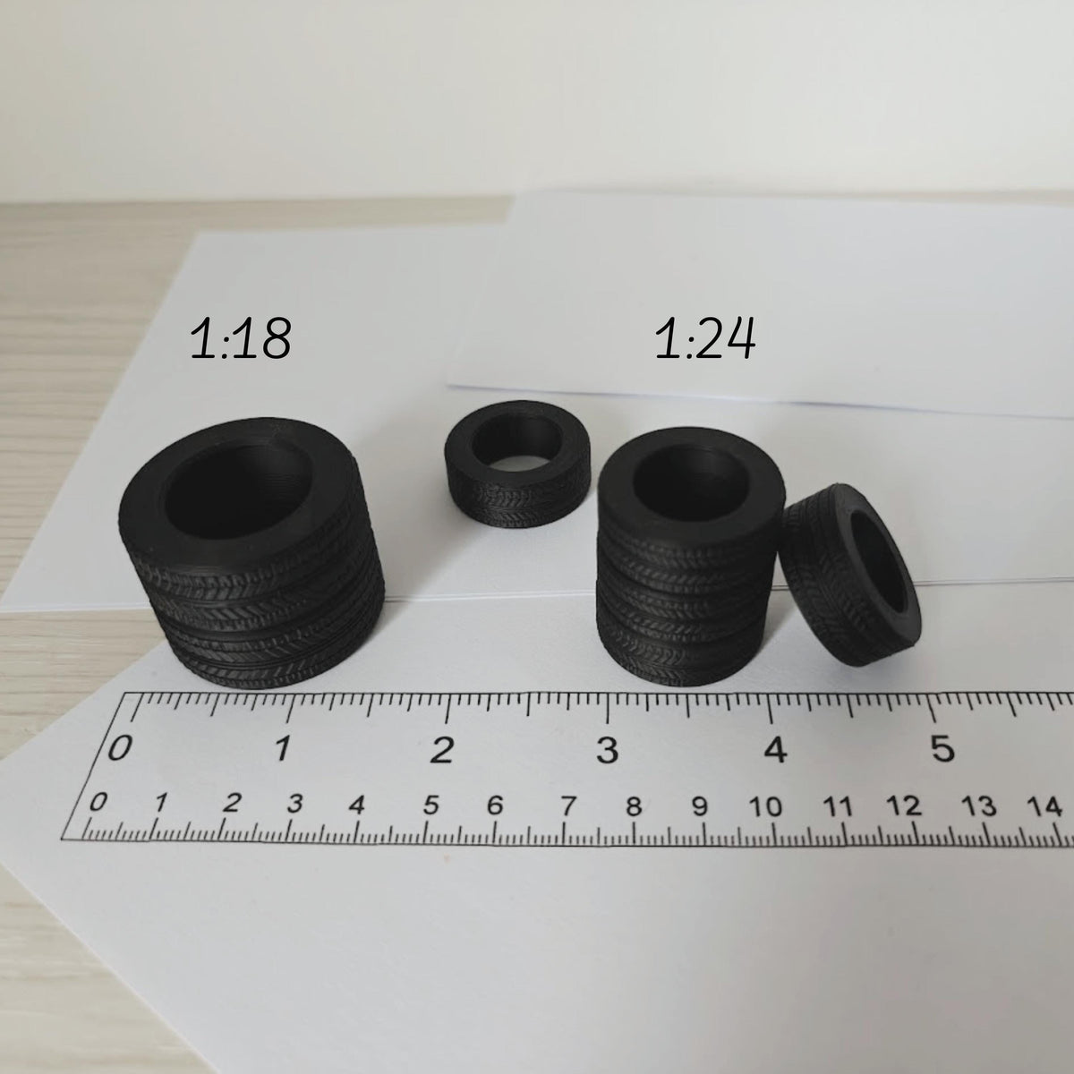 1:18 and 1:24 scale tires placed next to ruler for accurate size reference
