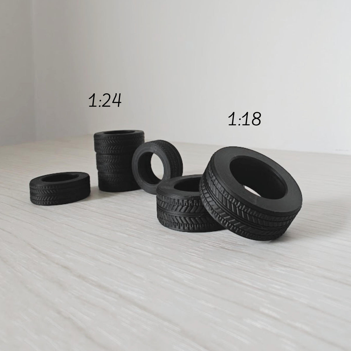 Grouped mini tires in different sizes for model car and garage dioramas