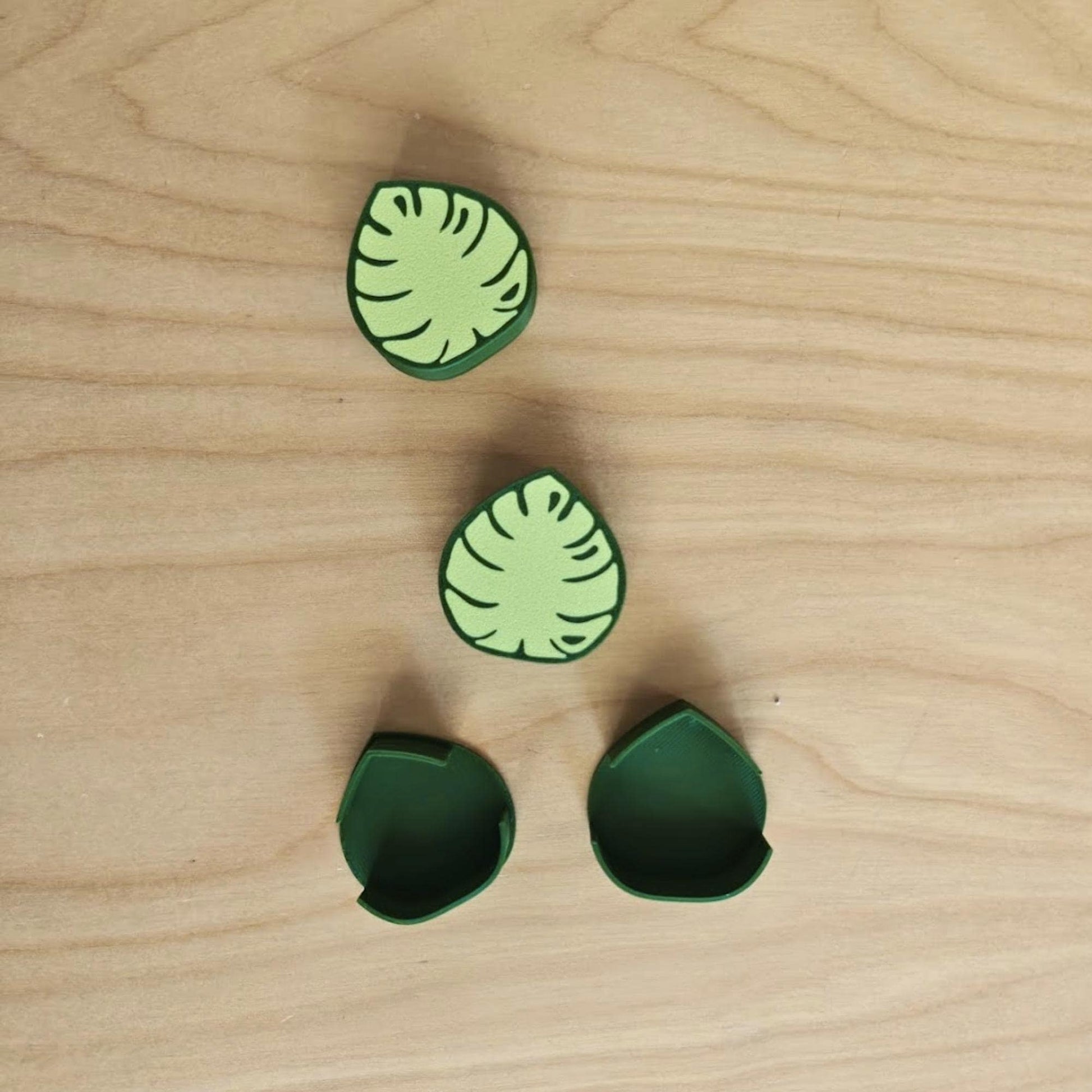 Close-up of green monstera cable clips