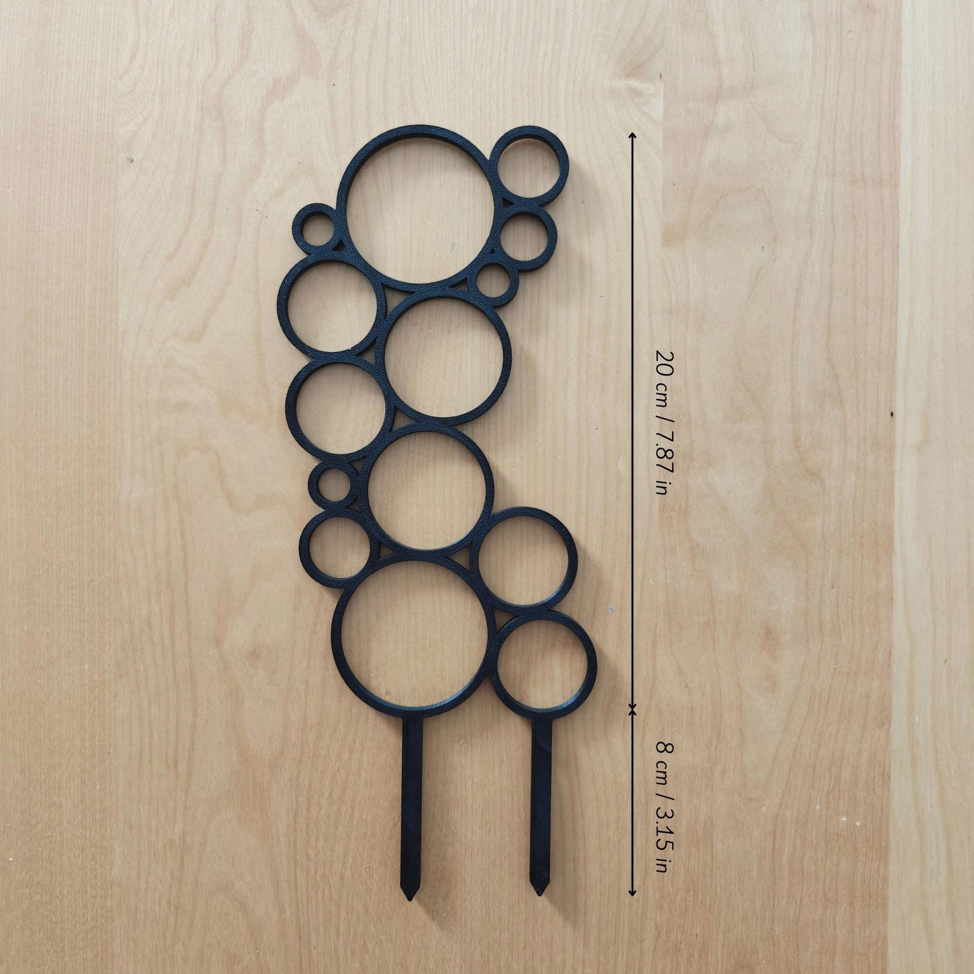 Single circular trellis base module placed on wooden surface with measurement labels