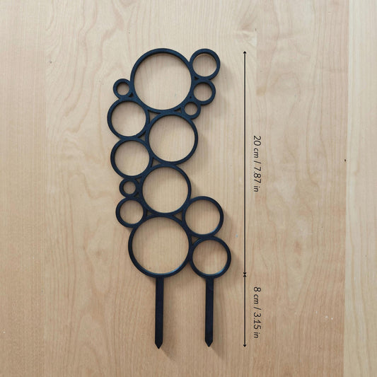 Single circular trellis base module placed on wooden surface with measurement labels
