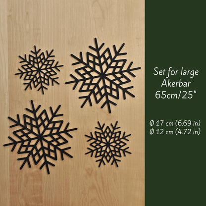 Set of 3D-printed snowflake decorations for large Äkerbar, shown on wooden background with sizes Ø17 cm and Ø12 cm.