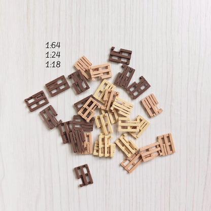 Miniature broken pallets scattered on surface