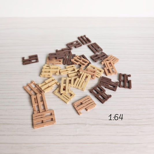 Miniature broken pallets in 1:64 scale scattered on surface