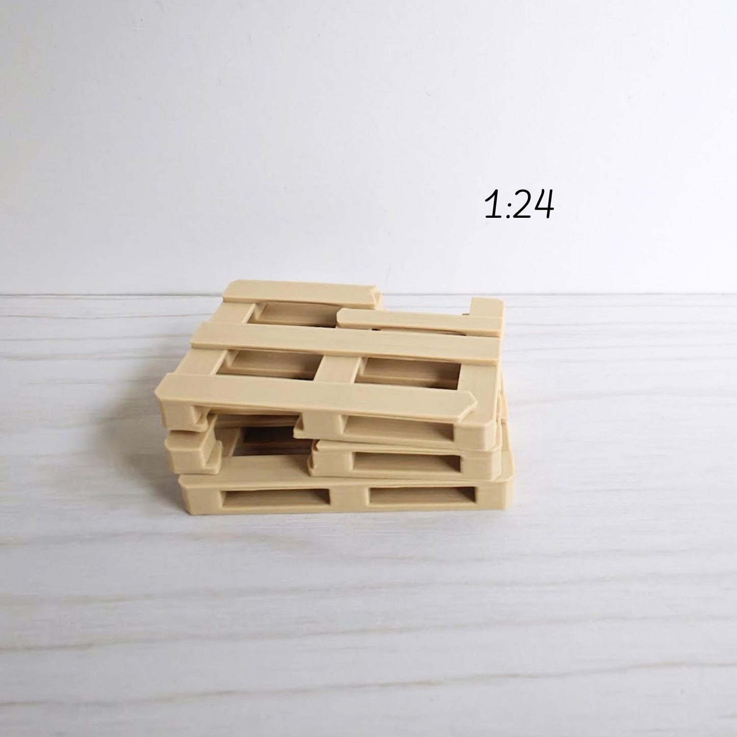 Stacked miniature pallets in 1:24 scale for warehouse or garage diorama