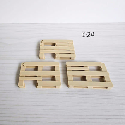 1:24 scale miniature pallets displayed in larger size for comparison