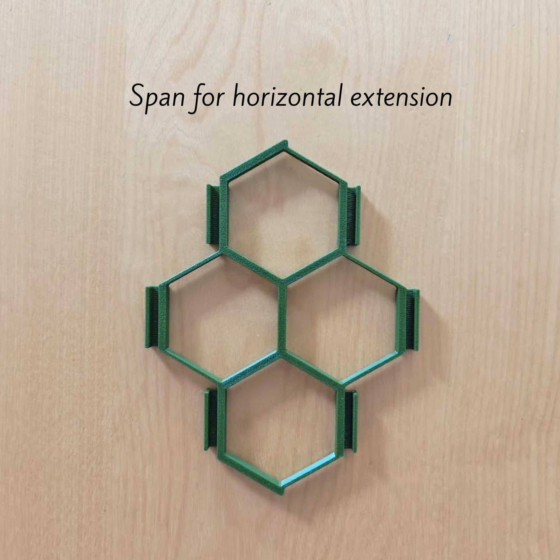 Single honeycomb trellis section with dimensions on wooden background