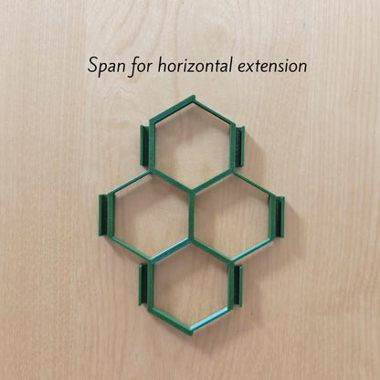 Single honeycomb trellis section with dimensions on wooden background