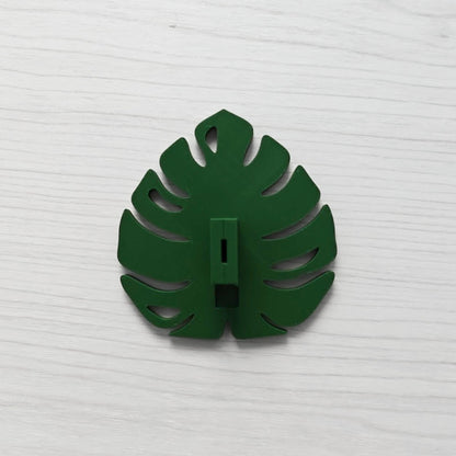 Back view of the Monstera leaf handle with the key cover inserted vertically.
