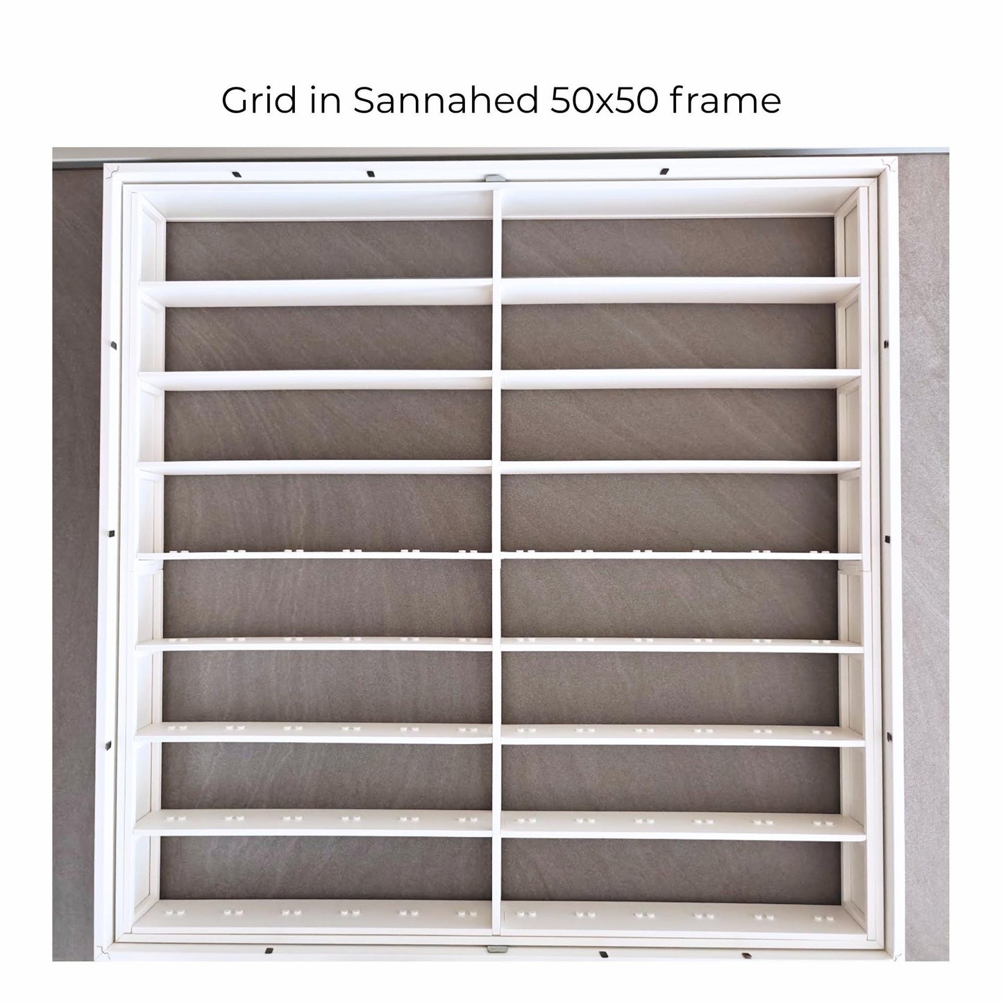 White assembled grid insert placed inside IKEA Sannahed 50x50 frame before final use.