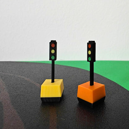 1/64 scale portable traffic lights with yellow and orange bases on road diorama