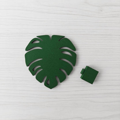 Solid leaf green Monstera leaf handle with the separate green key cover piece shown beside it.