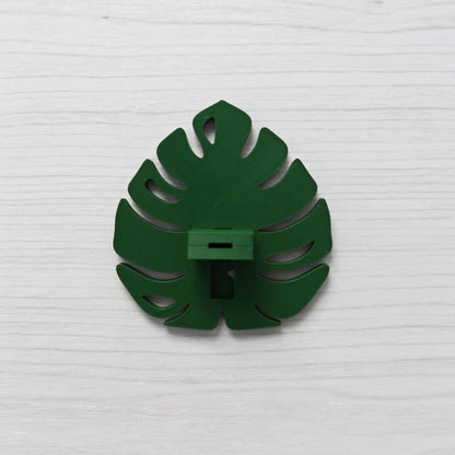 Back view of the Monstera leaf handle with the key cover inserted horizontally.