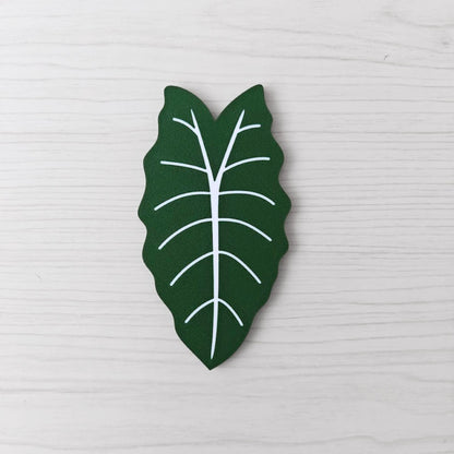 Front view of the solid green Alocasia Chantrieri key cover handle on a light wood background.