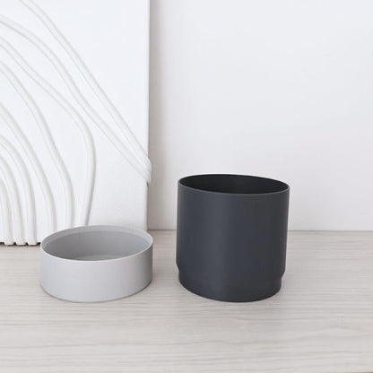 Smooth inner pot and bottom reservoir shown empty and separated.