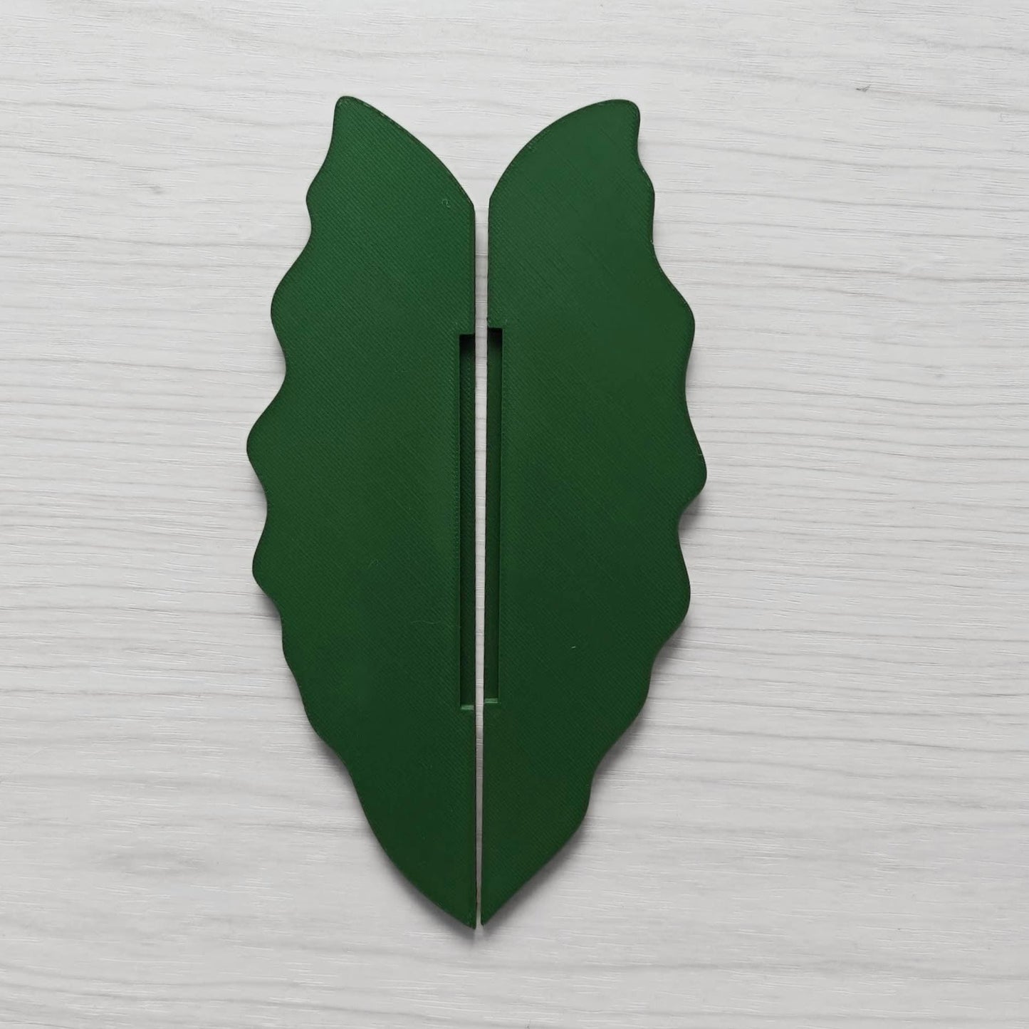 Back view of leaf handle showing vertical slot for sliding onto cabinet frame