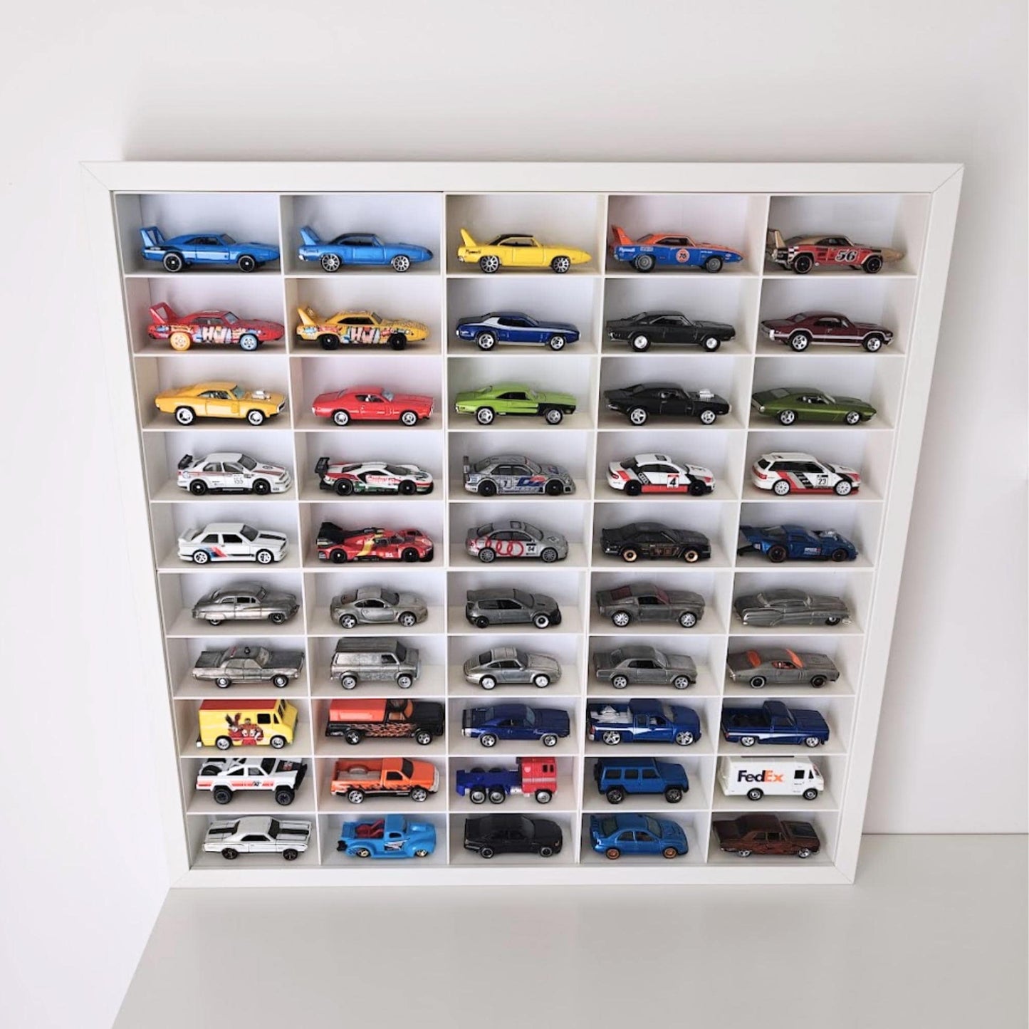 Angled view of diecast car display inside white Sannahed frame