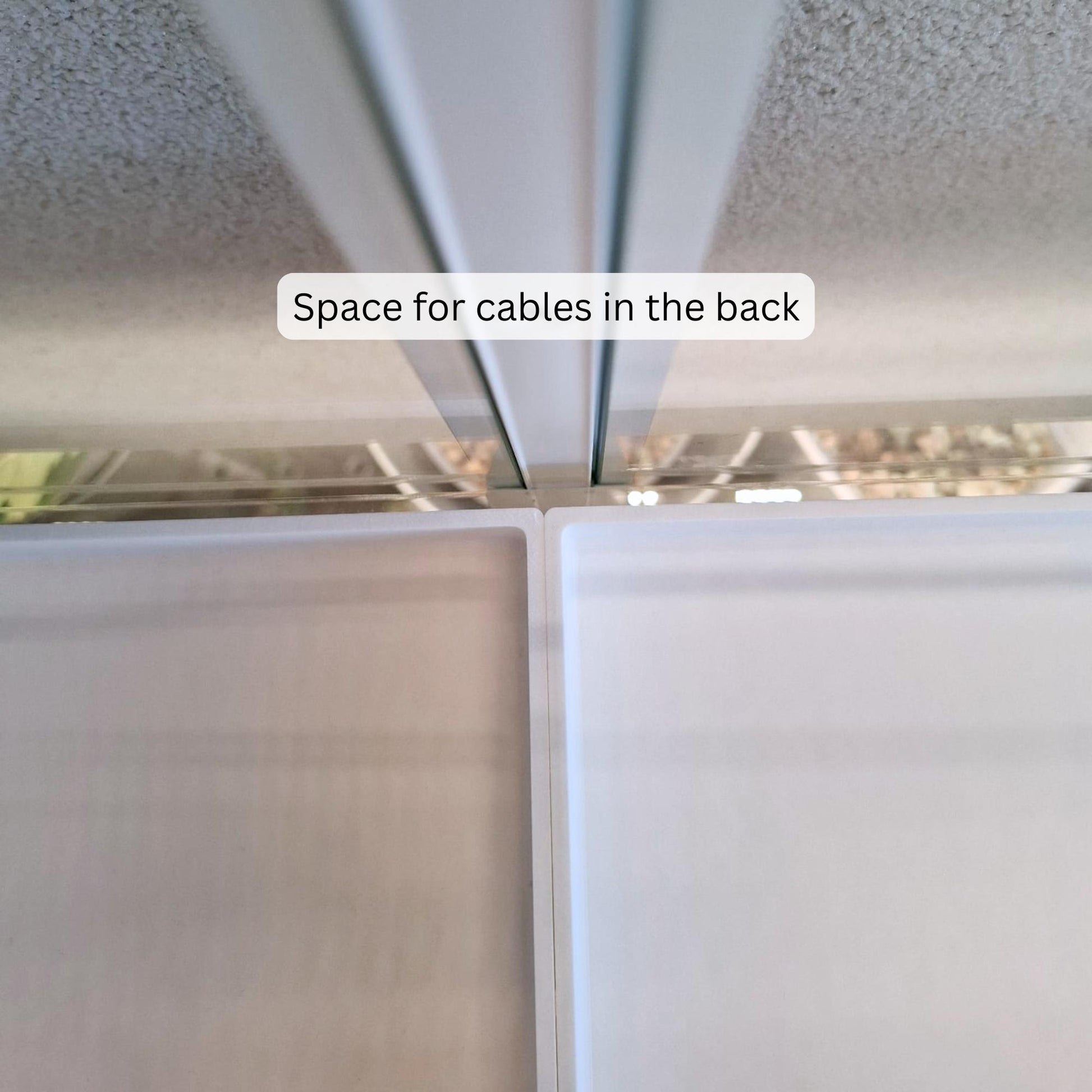 Gap between trays allowing space for cables at the back