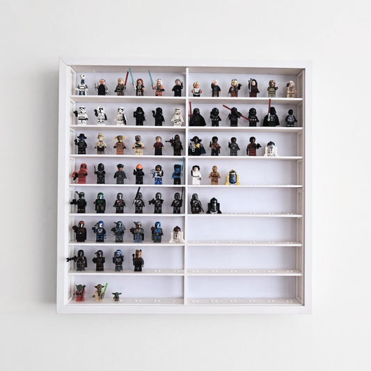 White LEGO minifigure grid insert displayed inside an IKEA Sannahed 50x50 frame with minifigures arranged on the shelves.