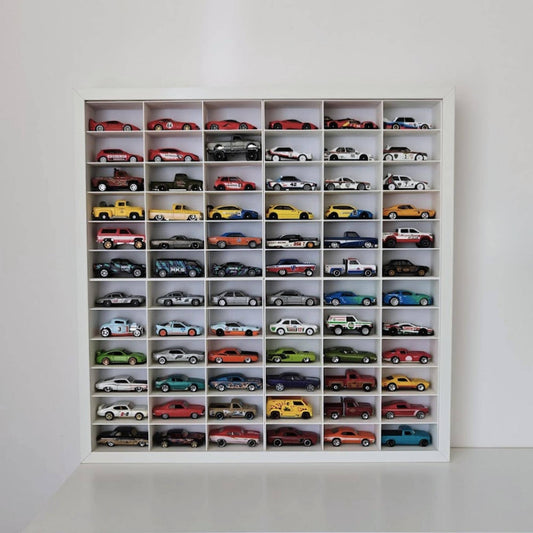 White IKEA Sannahed frame with 72 Hot Wheels cars displayed in grid insert on a shelf
