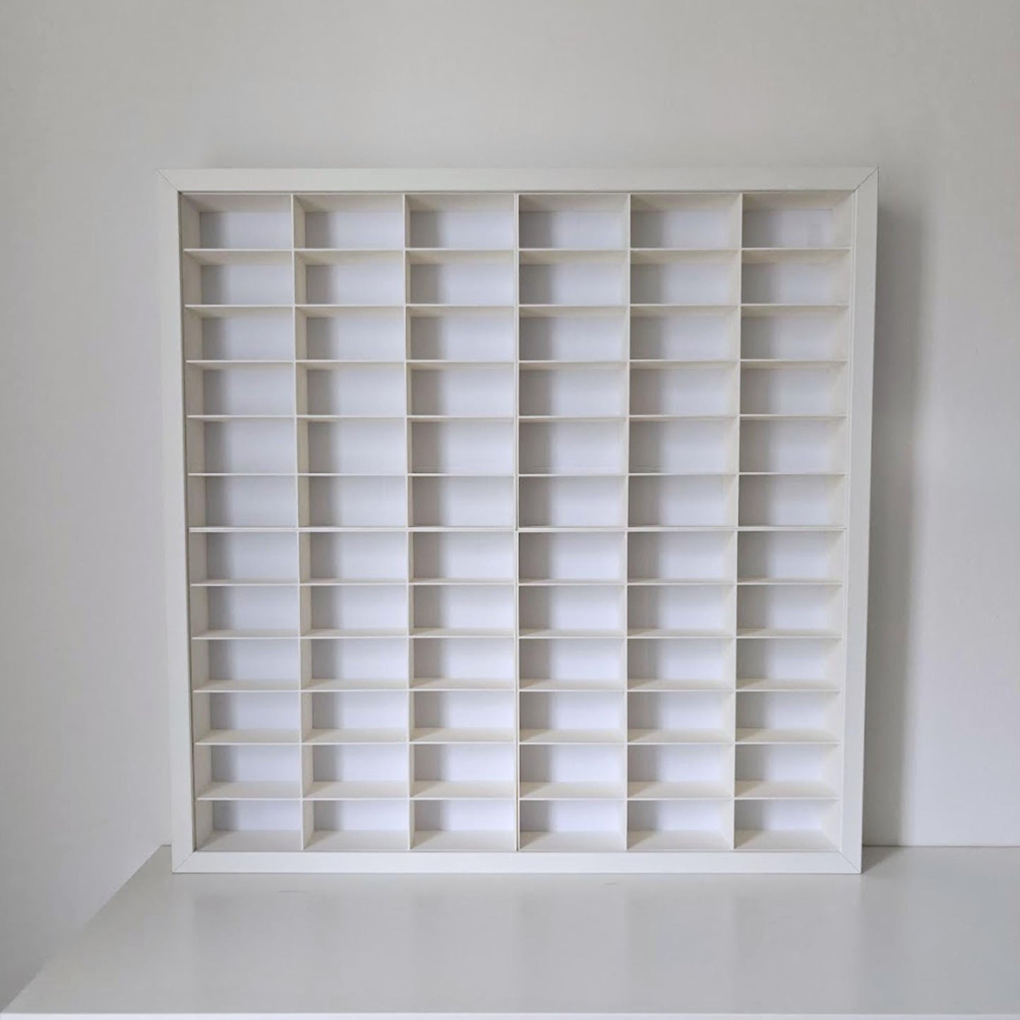 Empty white grid insert for IKEA Sannahed frame showing 72 compartments
