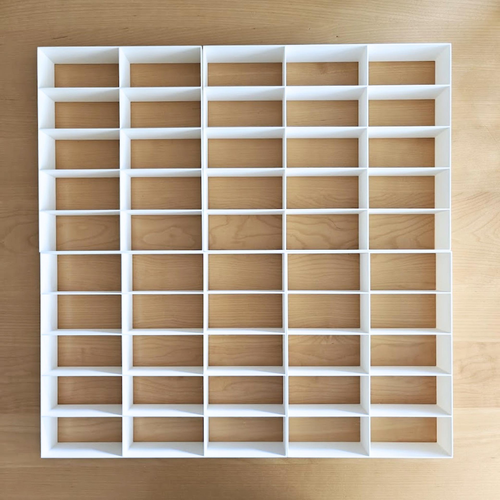 Grid inserts showing 50-slot layout for diecast cars