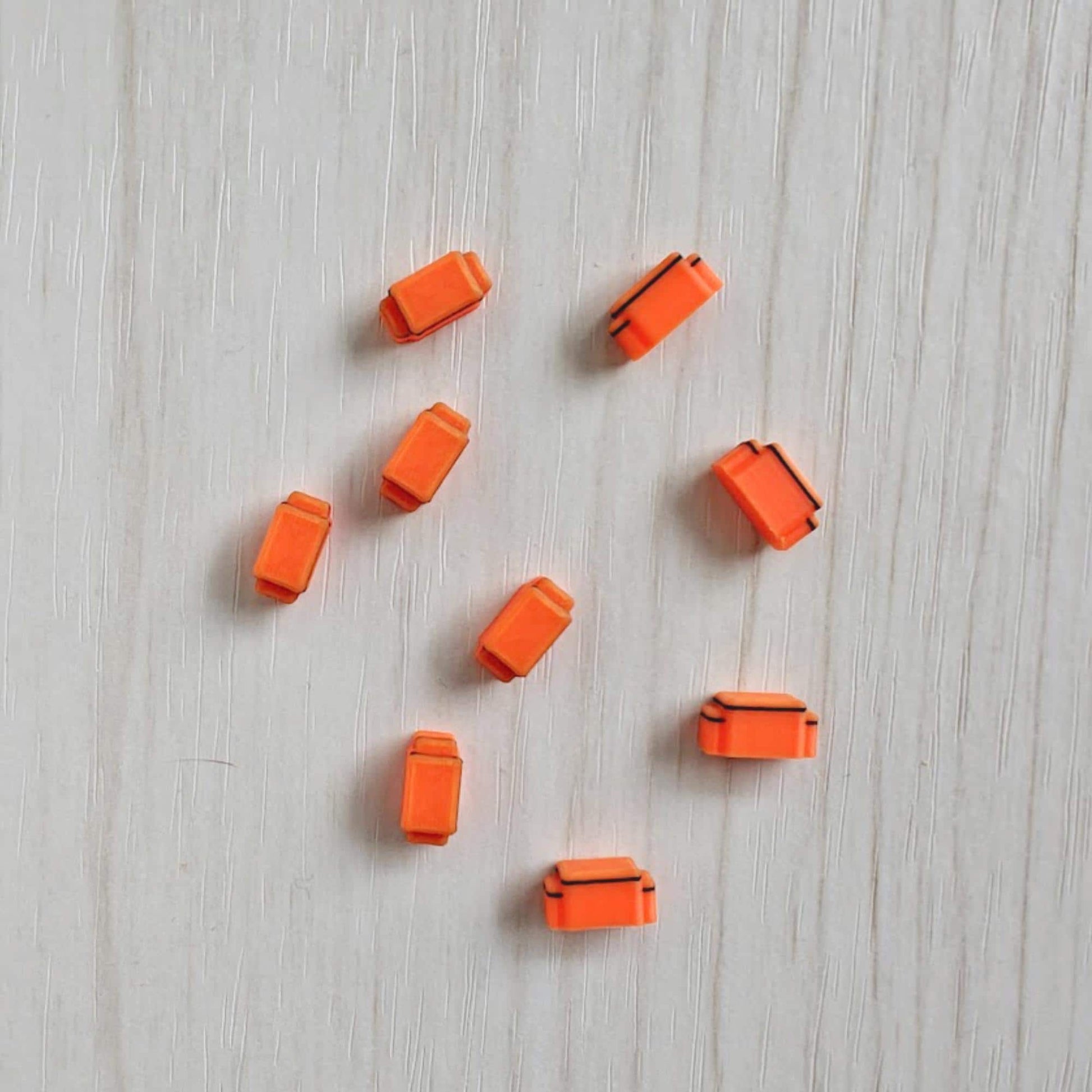 Miniature orange medical bags in 1/64 scale for ambulance diorama accessories