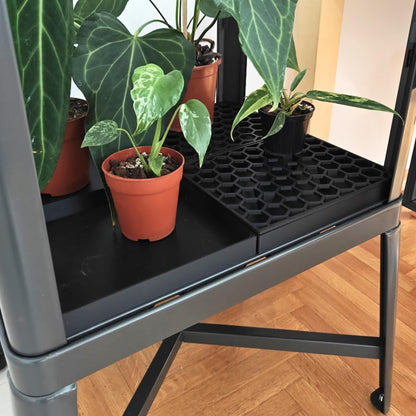 Drainage trays with honeycomb lids inside IKEA Fabrikor tall cabinet with plants