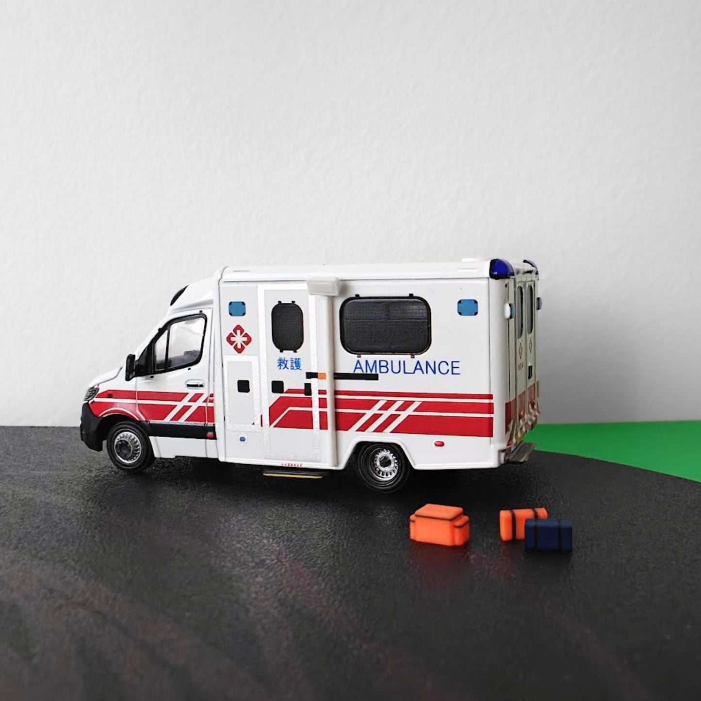 Vehicle with mounted scene light and EMS bags