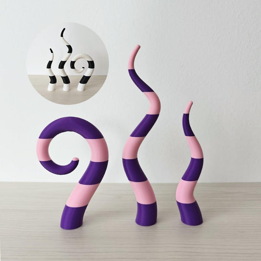 Beetlejuice sandworm plant stakes purple and black striped decor set on wooden surface