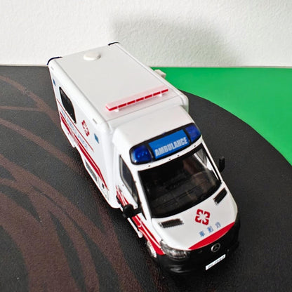 Red single row roof light bar mounted on a small ambulance model for diorama display