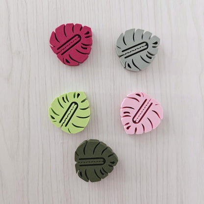 Set of five leaf-shaped bag clips in green, sage, pink, plum and bright green colors.