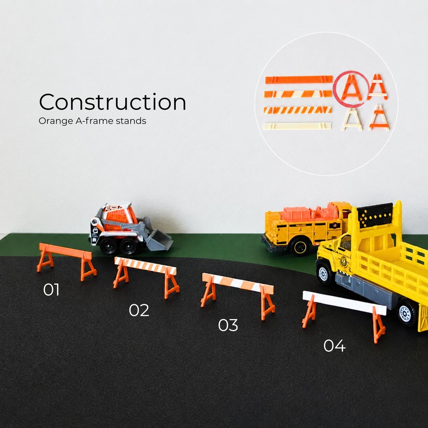 Orange construction A-frame barricades with roadwork vehicles and miniature street barrier setup