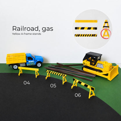 Yellow A-frame railroad barricades with black warning stripes for 1:64 scale construction dioramas