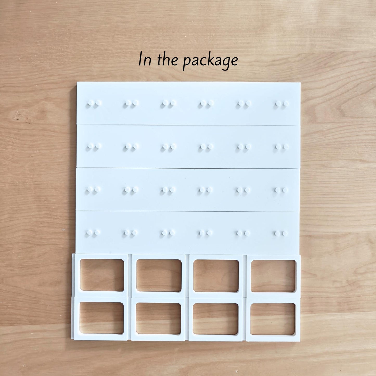 White grid insert with small holders designed for LEGO minifigures