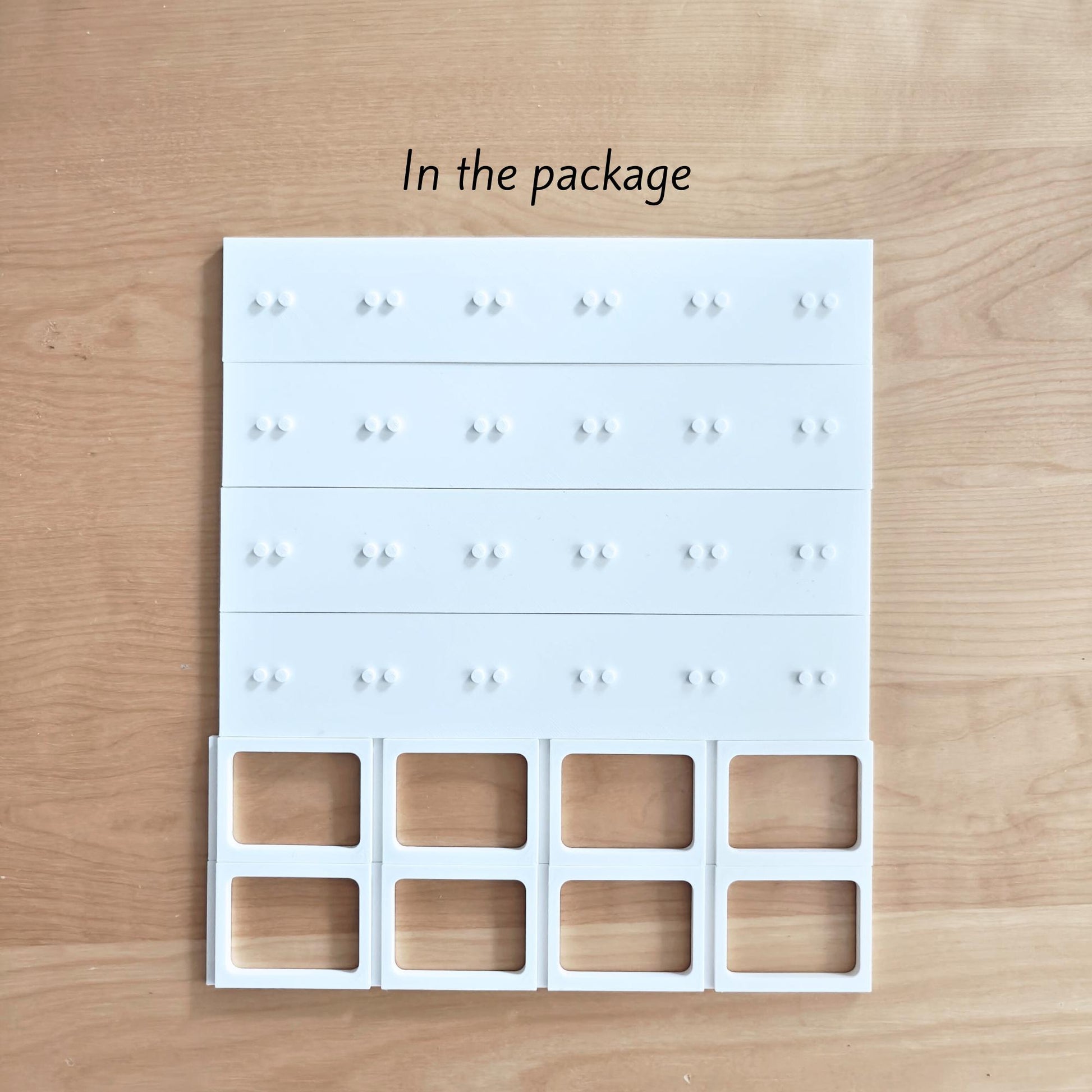White grid insert with small holders designed for LEGO minifigures