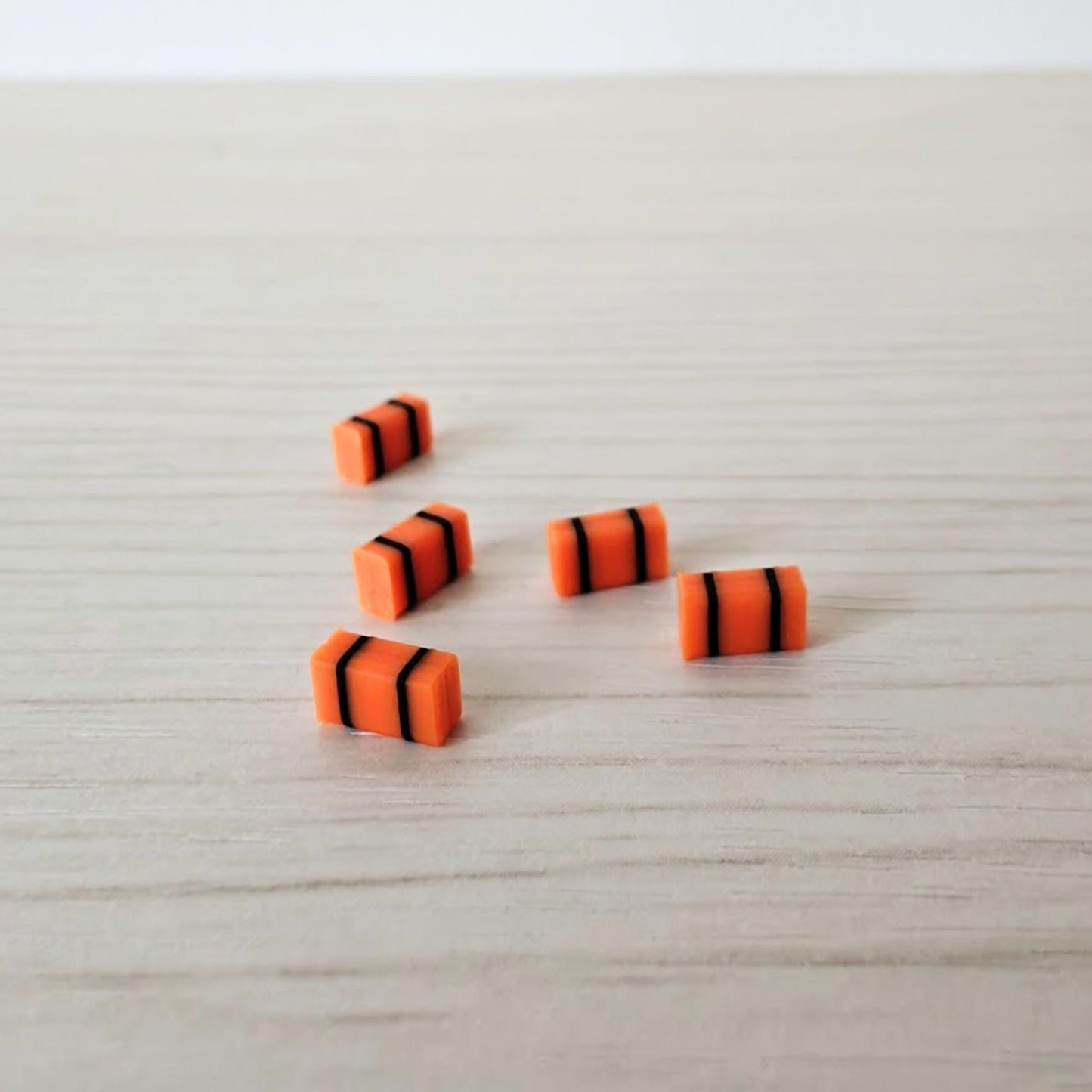 Small orange medical bags in 1/64 scale