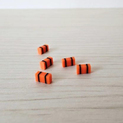 Small orange medical bags in 1/64 scale