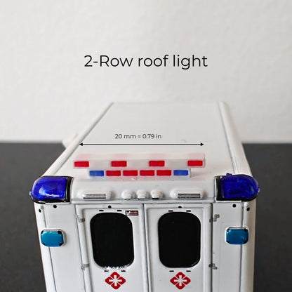 Double row red and blue roof light accessory on top of a 1:64 scale ambulance model