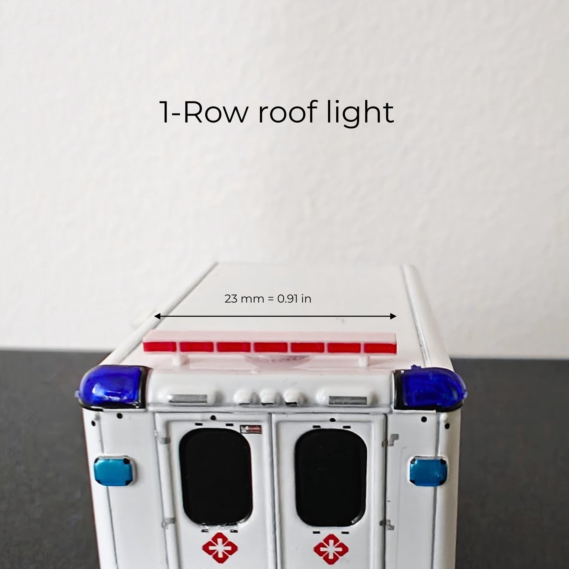 Single row red and blue roof light accessory on top of a 1:64 scale ambulance model