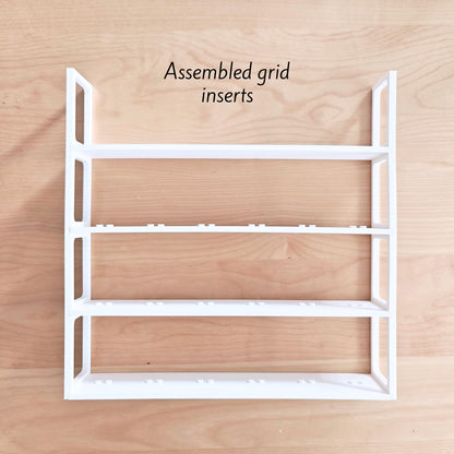 White grid insert structure with shelves for LEGO minifigures