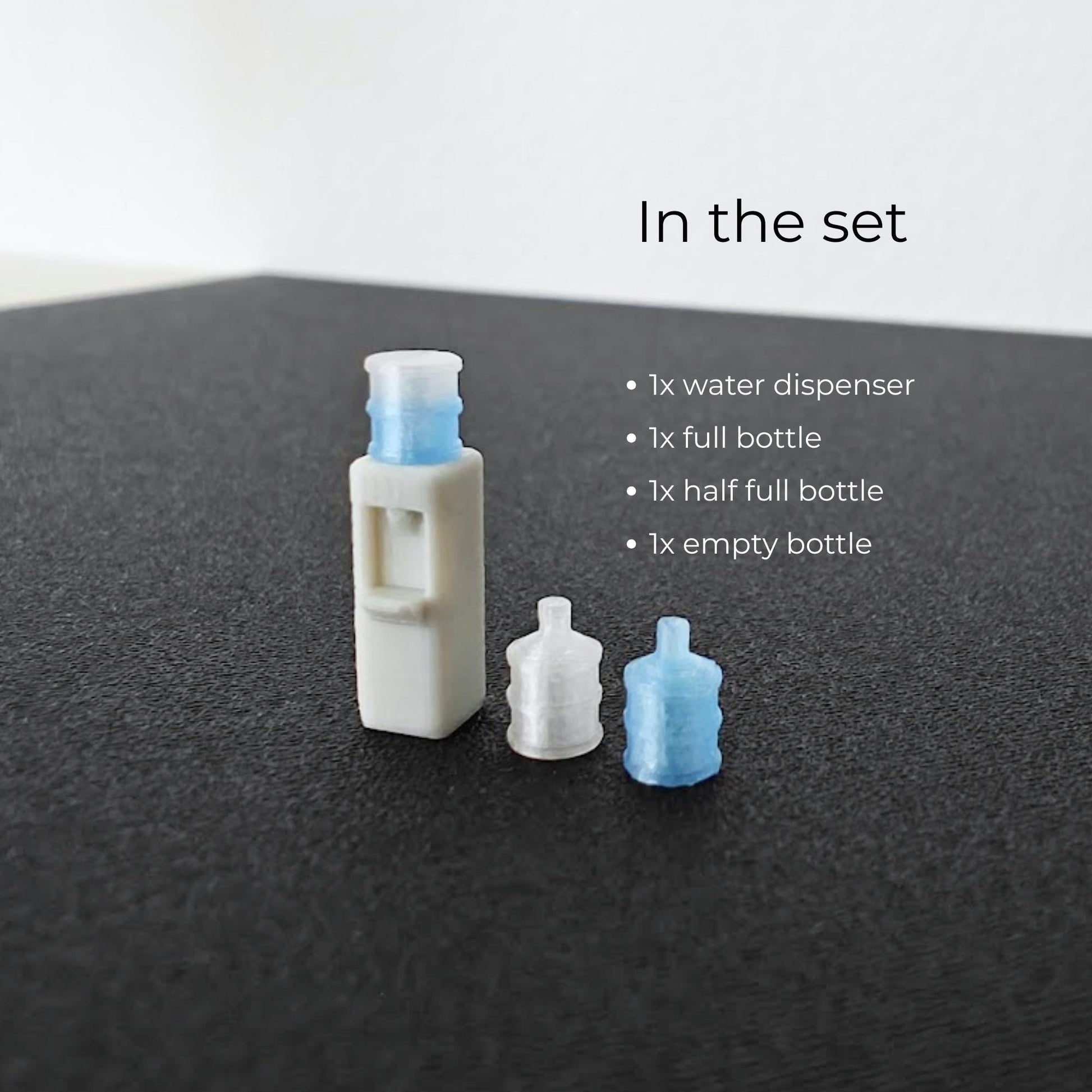 Miniature water cooler set with one dispenser, one full bottle, one half full bottle, and one empty bottle for 1:64 dioramas.