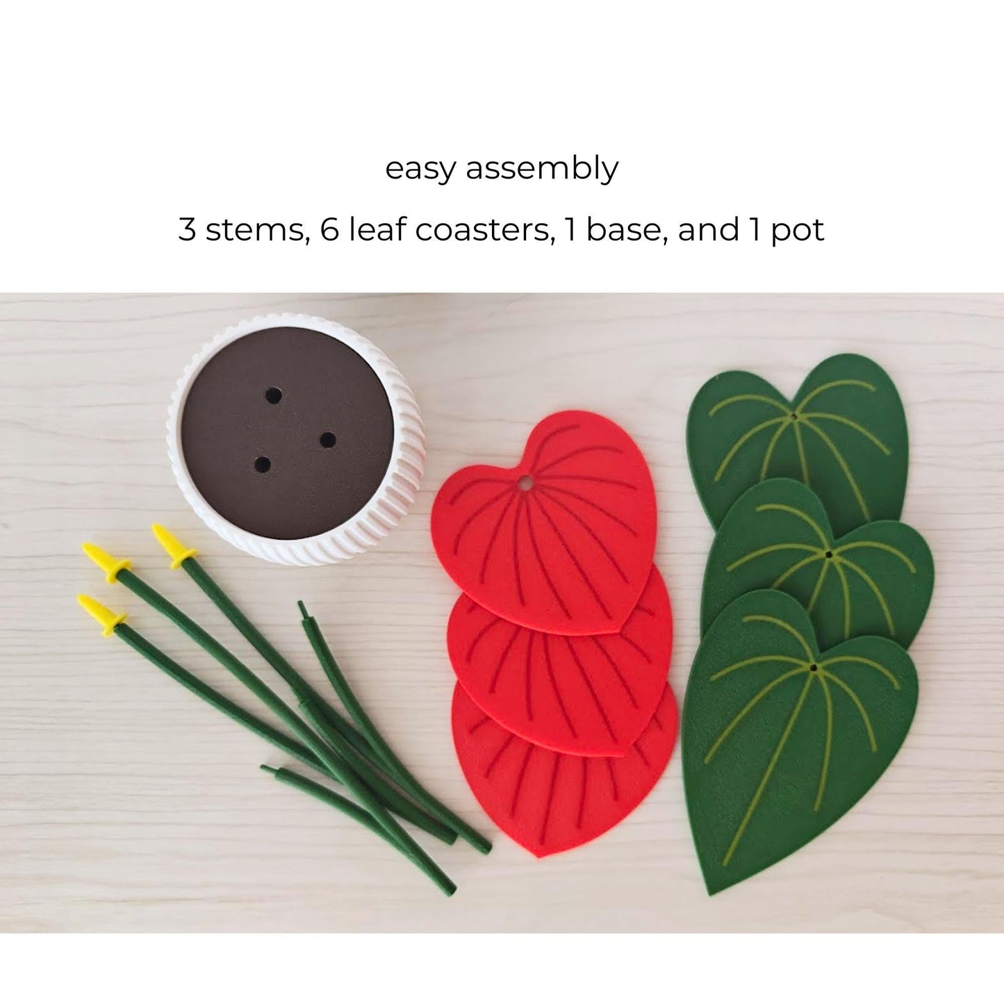Anthurium plant coaster set parts showing 3 stems, 6 leaf coasters, base and pot for easy assembly.