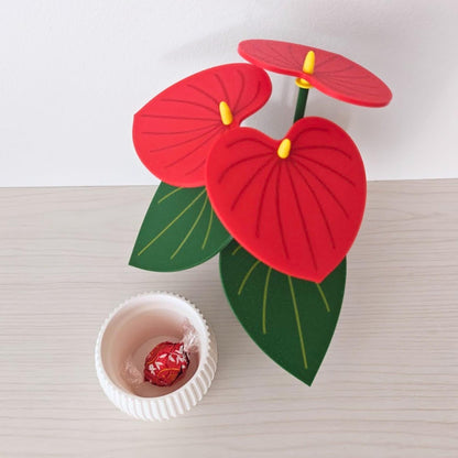 Red Anthurium coaster plant with hidden pot storage shown holding small jewelry or trinkets.