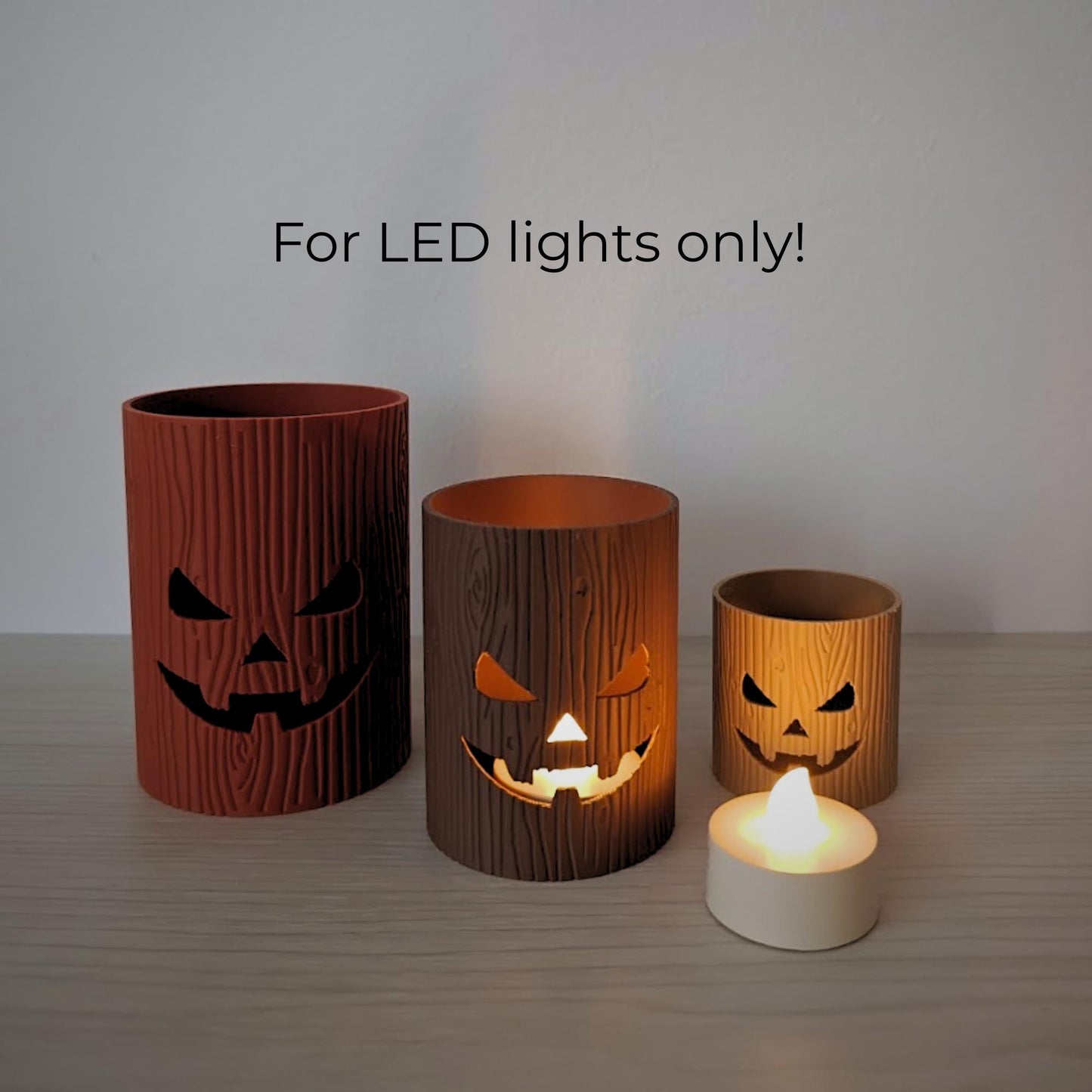 Halloween tree stump lanterns with LED lights only warning.